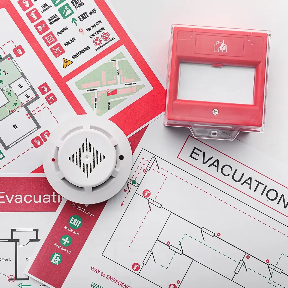 Professional fire safety planning for Toronto buildings according to Ontario Fire Code Section 2.8, featuring emergency evacuation maps and fire alarm components.