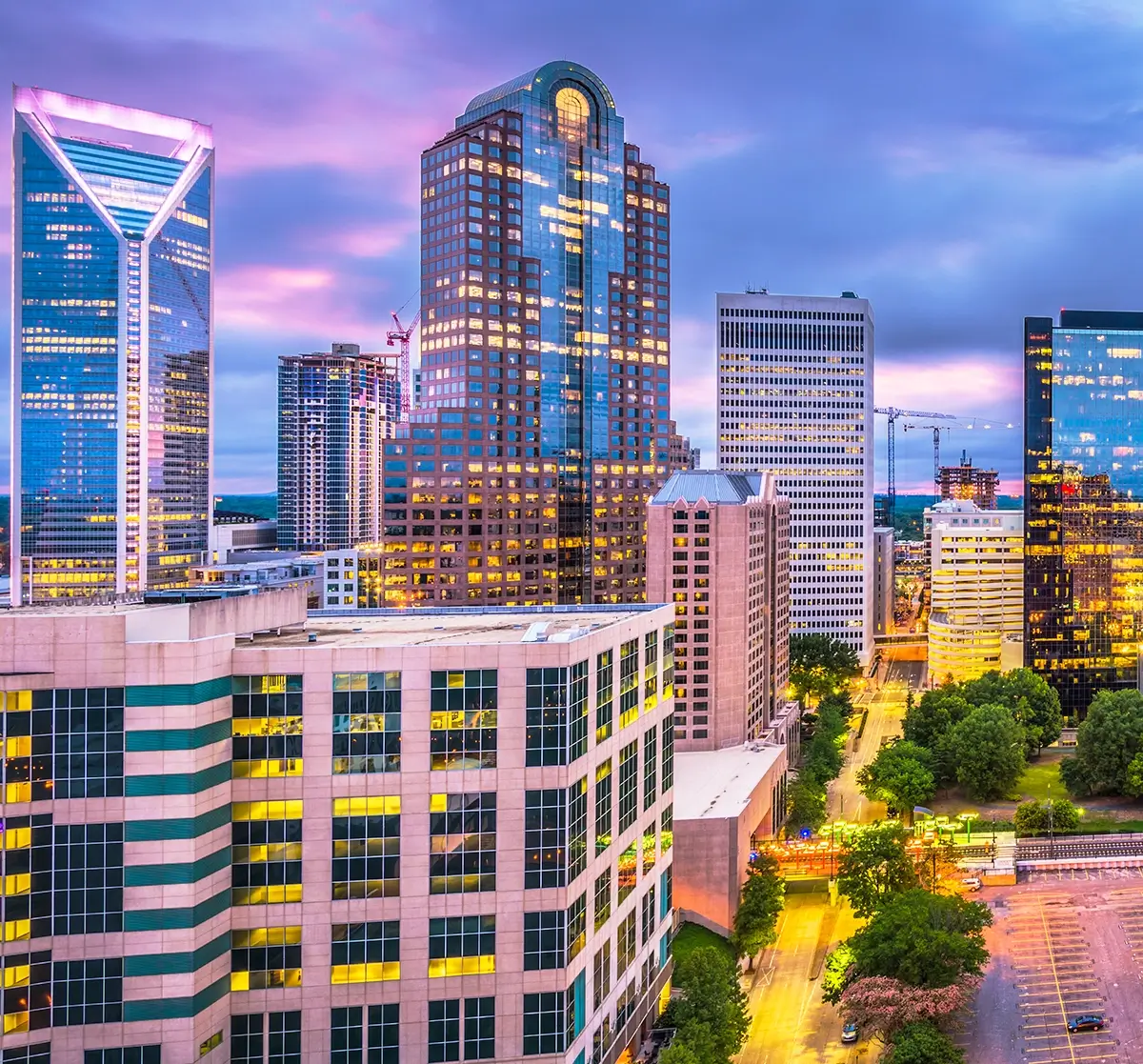 A comprehensive emergency training in Charlotte being conducted for property managers and operations teams, illustrating high-rise evacuation routes, fire safety protocols, and multi-tenant emergency coordination plans inside a modern commercial office building.