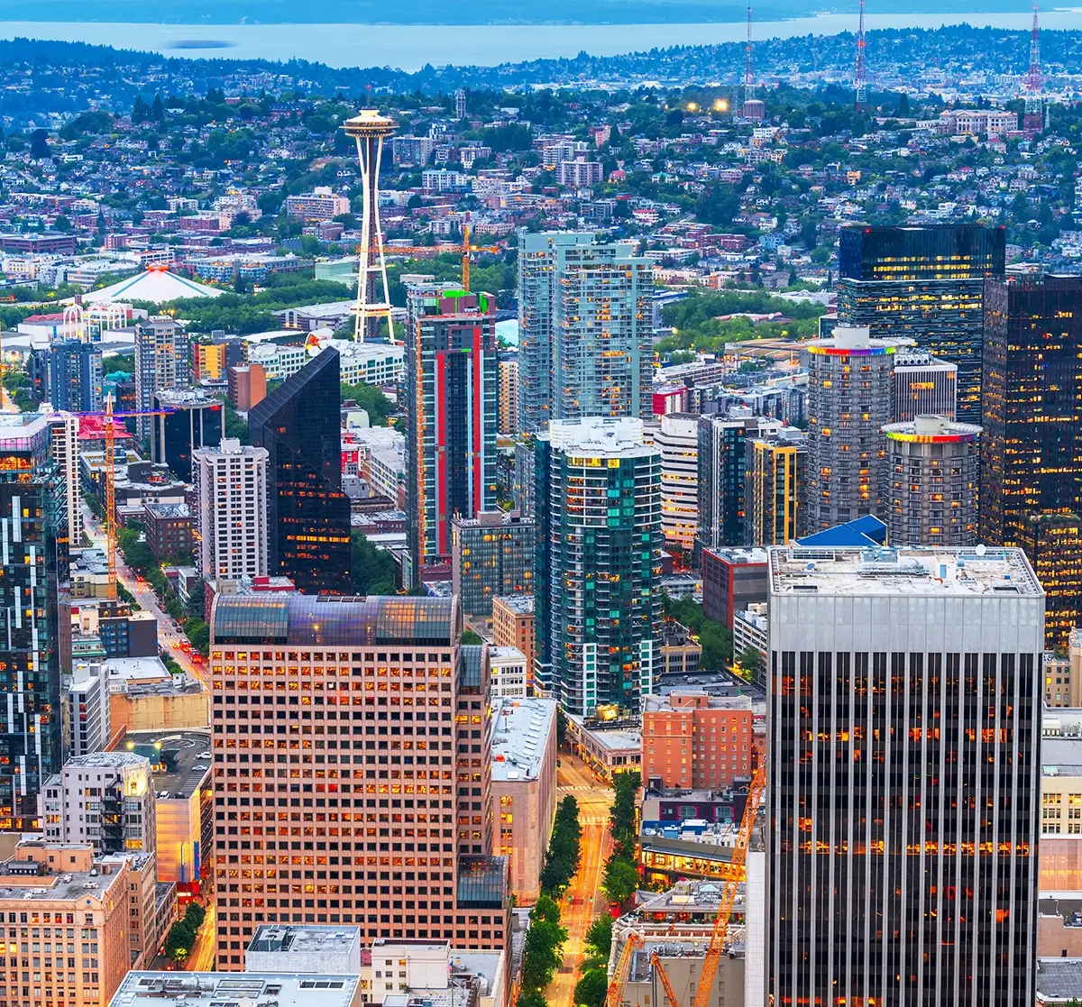 A comprehensive emergency training in Seattle being conducted for property managers and operations teams, illustrating high-rise evacuation routes, fire safety protocols, and multi-tenant emergency coordination plans inside a modern commercial office building.